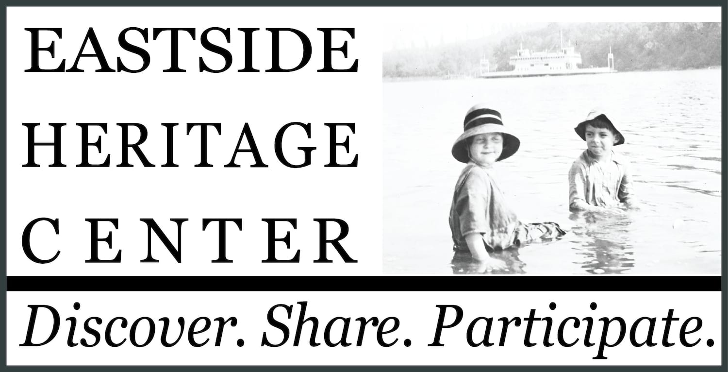 Black text on white background next to two kids wading in water. Reads Eastside Heritage Center. Discover. Share. Participate